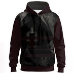 Wearable art hoodie with a cross over the mouth symbolizing religious control and enforced silence.