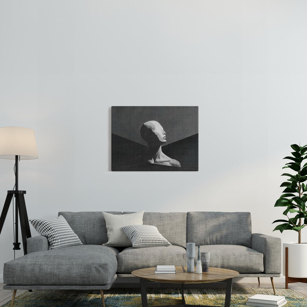 Human canvas print displayed above gray sofa in modern living room