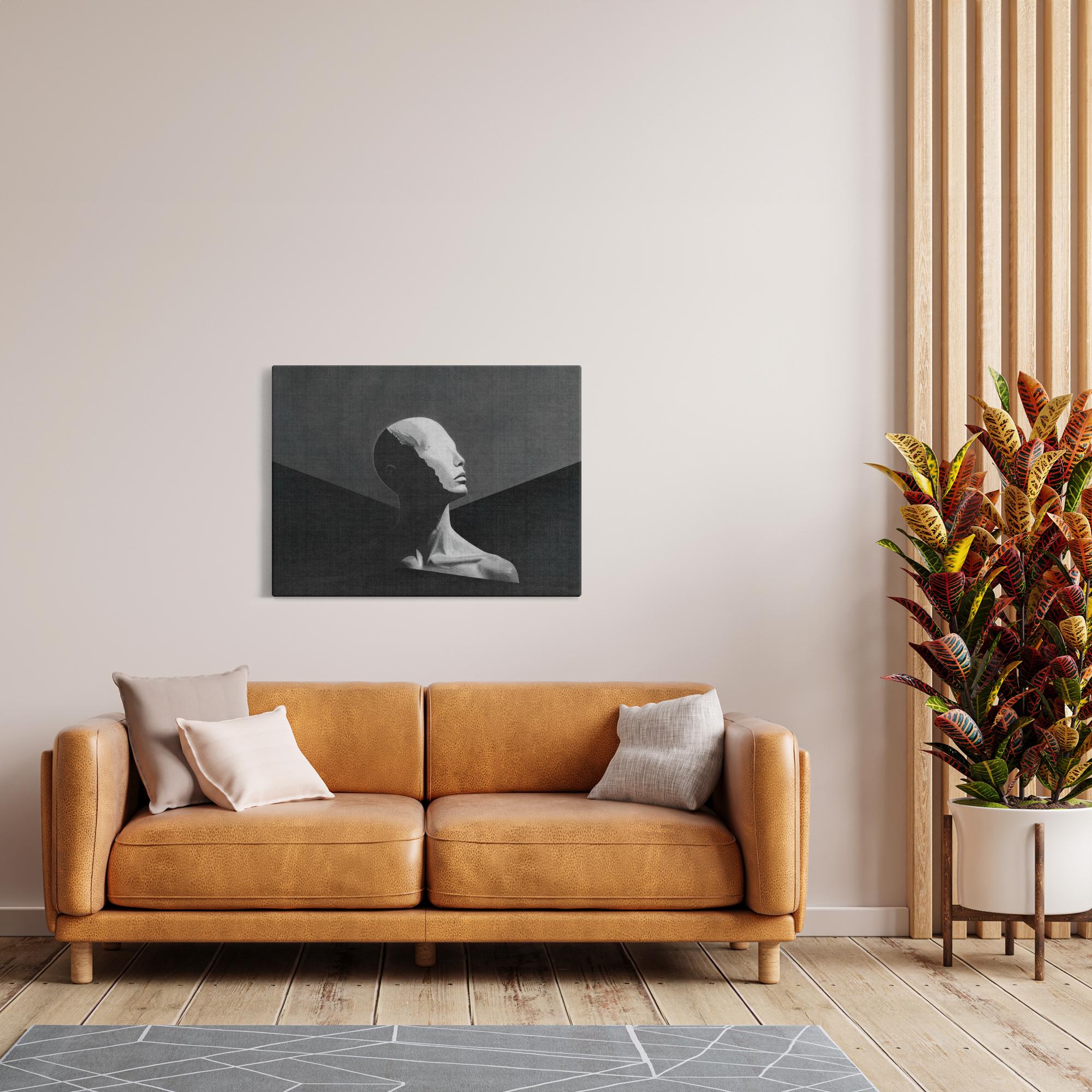 Mount Human artwork displayed in warm-toned living space with tan leather sofa