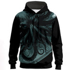 Dark oceanic creature with flowing tentacles in deep teal and black tones on statement hoodie
